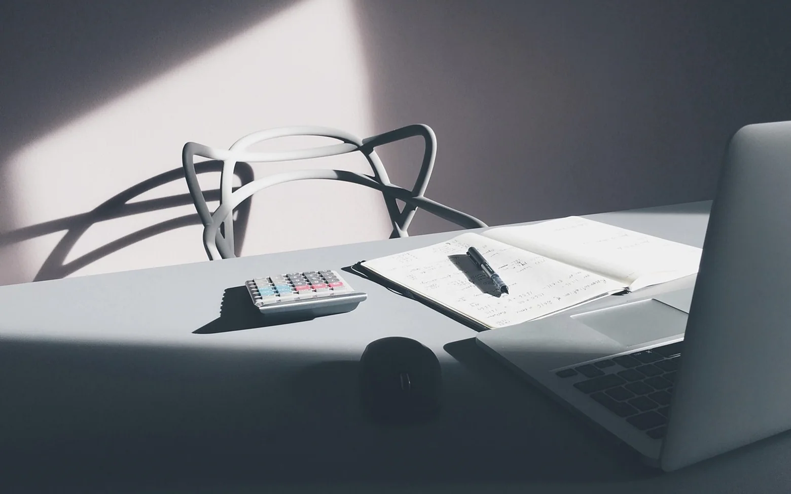 Chair, notebook and calculator
