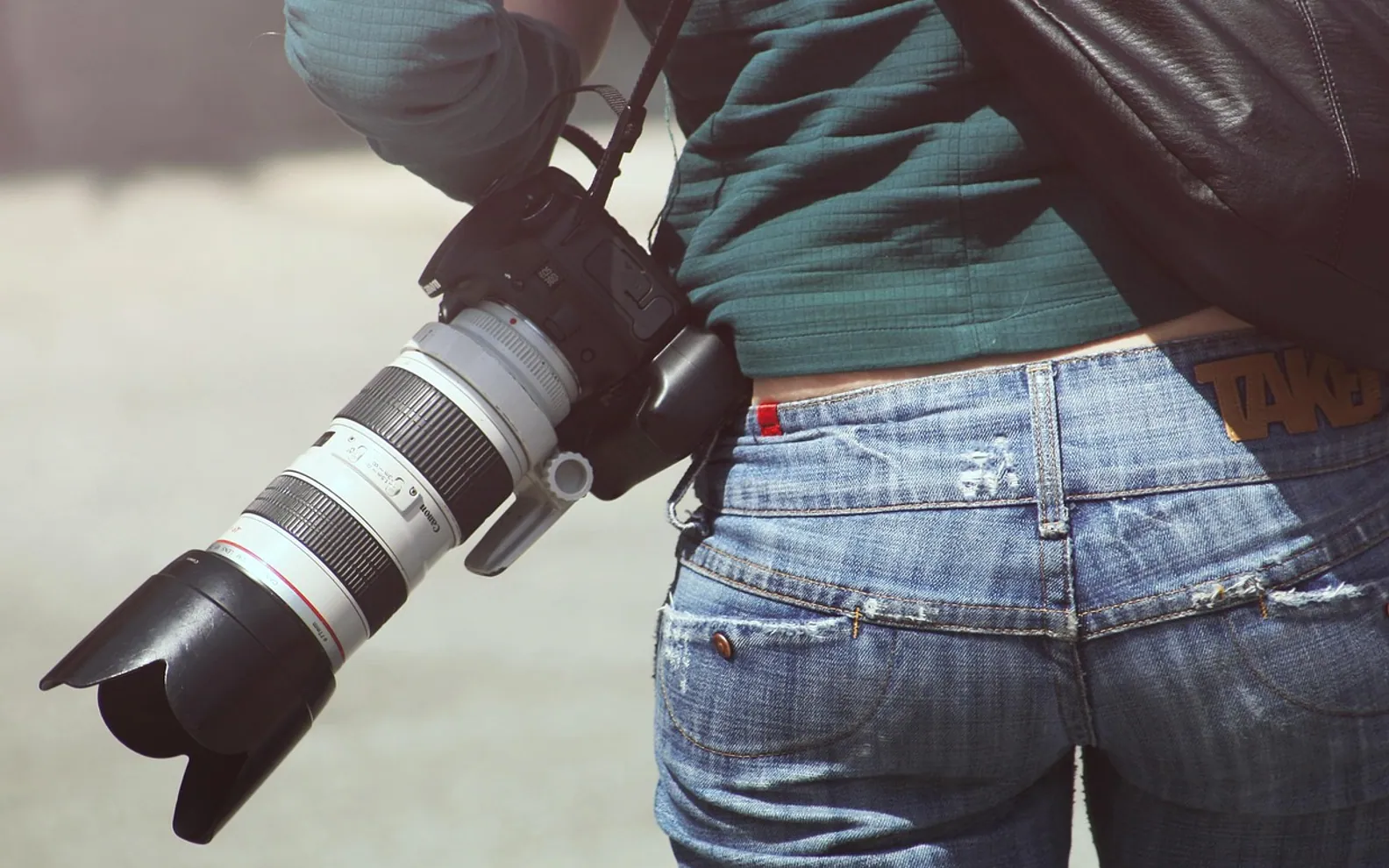 Woman, photographer and camera